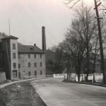Looking down the road in 1929. The Gore Mills and entrance is on the left side.