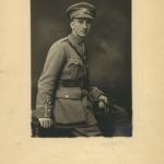 portrait of Lennard in his full service uniform. He holds gloves in his left hand.