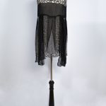 black dress made with detailed tambour beading.