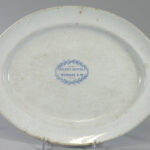 face of white oval platter. A blue stamp reads "Riley's Hotel, Dundas, C.W."