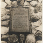 Black and white postcard with a detail image of the plaque on the Commemorative monument to Dundas Street and Governor's Road