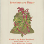 Cover of a dinner menu with a festive gold bell covered in holly