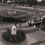 Black and white photograph of a baseball diamond with crowds in bleachers.